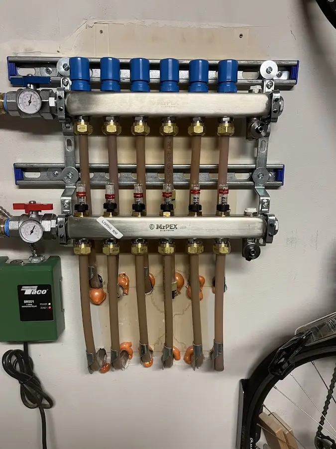 Plumber performing Gas Line Installation at a residential property in West Liberty